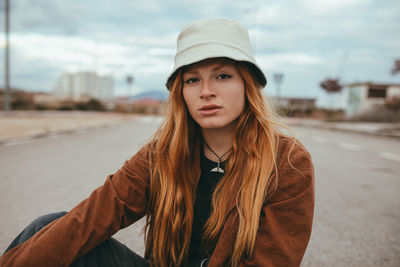 Portrait of beautiful young woman in car