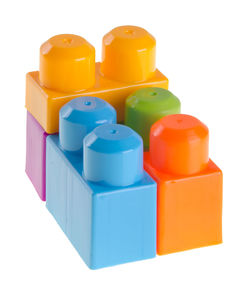 Close-up of multi colored building blocks against white background