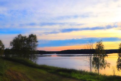 Scenic view of lake against sky during sunset