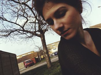 Close-up portrait of man against sky