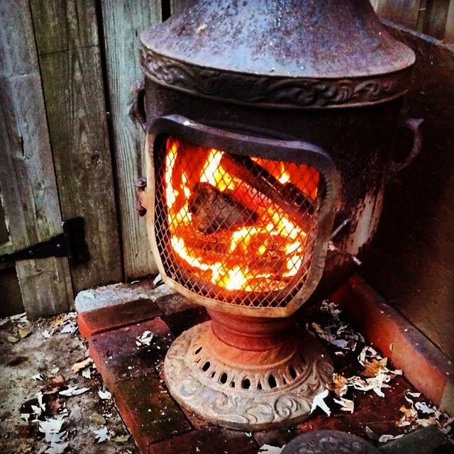 fire - natural phenomenon, burning, flame, heat - temperature, close-up, high angle view, metal, wood - material, old, rusty, glowing, fire, orange color, indoors, no people, firewood, old-fashioned, candle, illuminated