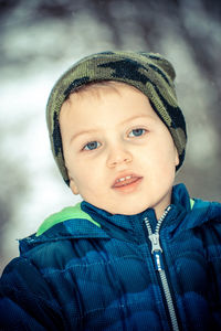 Portrait of cute boy in snow