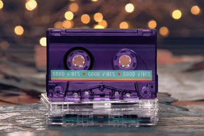 Close-up of illuminated cassettes on table