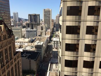 Modern buildings in city against clear sky