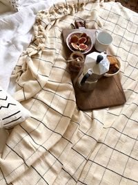 High angle view of food and drink on bed