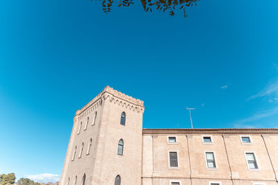 Low angle view of building against clear blue sky