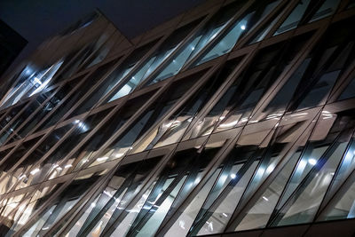 Low angle view of modern building at night