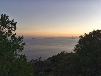 Scenic view of landscape against sky at sunset