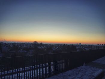 Cityscape against clear sky during winter