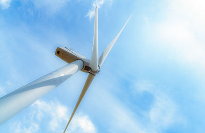 Low angle view of windmill against sky