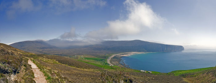 Panoramic view of sea and land against sky