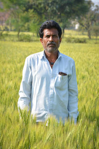 Indian farmer at wheat field