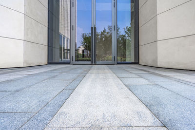 Footpath by building against sky