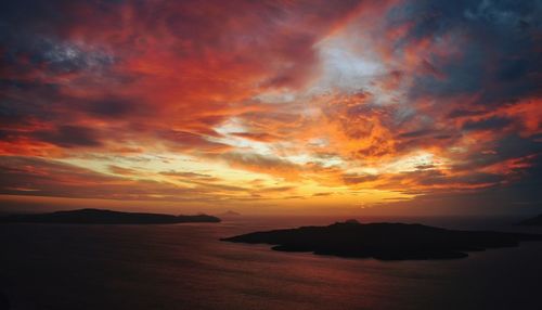 Scenic view of dramatic sky over sea during sunset