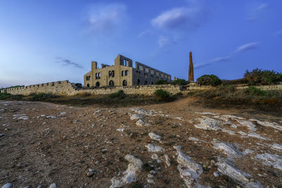 Old ruin building against sky