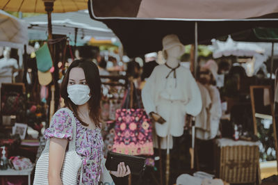 Series photo of young woman travel and shopping in street market , chiang mai north of thailand