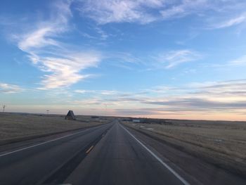 Road against sky during sunset