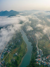 Aerial view of cityscape against sky