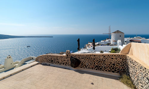 Scenic view of sea and buildings against sky