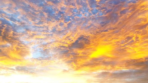 Low angle view of dramatic sky during sunset