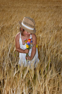 Rear view of child in the field