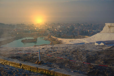 High angle view of buildings against sky during sunset