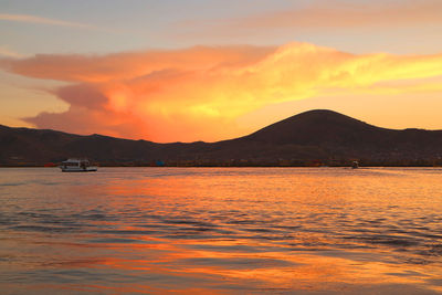 Scenic view of sea against romantic sky at sunset