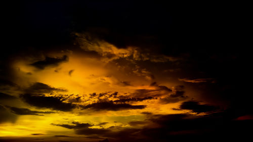 Low angle view of dramatic sky during sunset