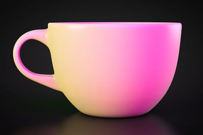 Close-up of coffee cup against black background