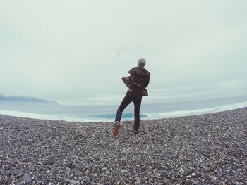 Woman standing on beach