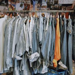 Clothes hanging on clothesline at store for sale