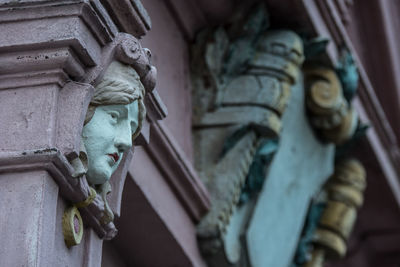 Low angle view of statue against building