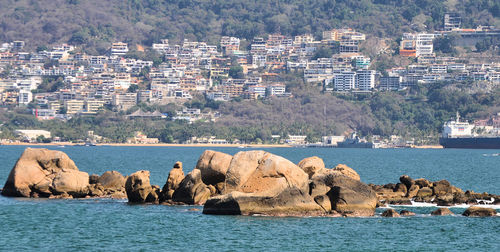 Sea with cityscape in background