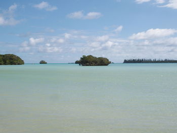 Scenic view of sea against cloudy sky