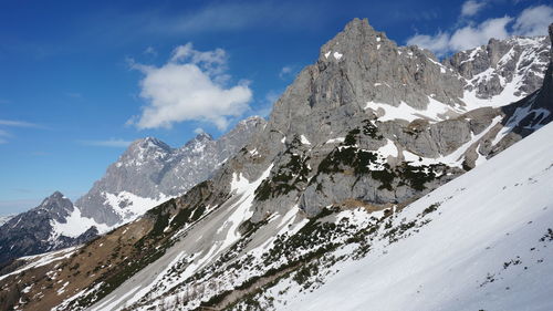 Scenic view of snowcapped mountains against sky