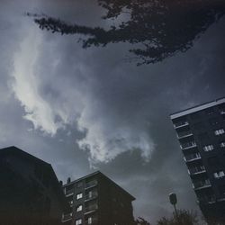 Low angle view of buildings in town against sky