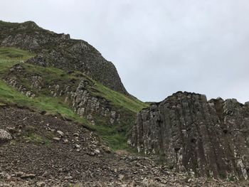 Low angle view of rocks against sky