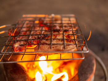 Close-up of fire on barbecue grill