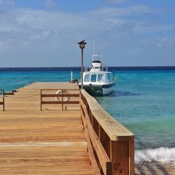 Pier on sea against sky