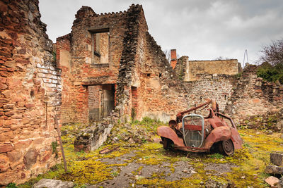 Old damaged building against sky