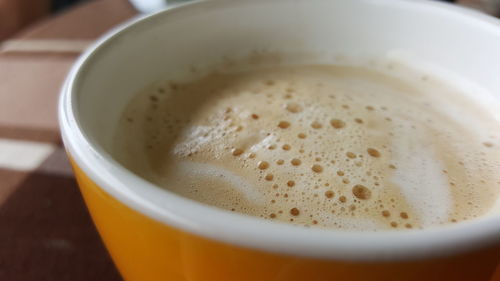 Close-up of coffee cup on table