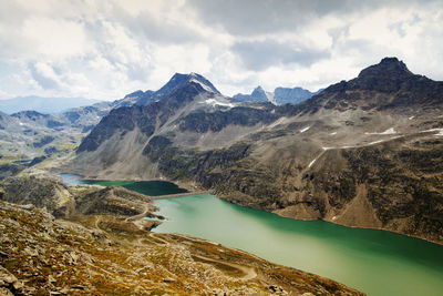 Scenic view of lake and mountains against sky