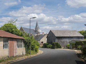 Street view entering a typical quiet french village, france