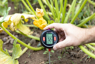 Soil test - measuring temperature and moisture content. greenhouse effect and global warming concept