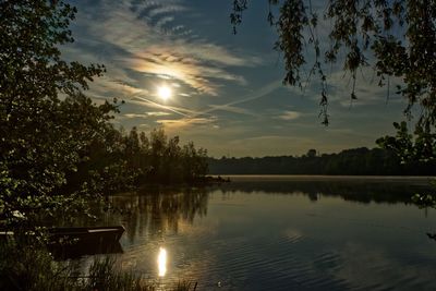 Scenic view of lake against sky during sunset