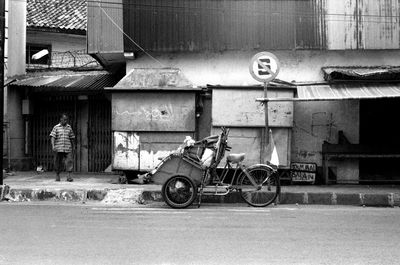 Bicycles parked against built structure