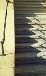 High angle view of yellow shadow on staircase