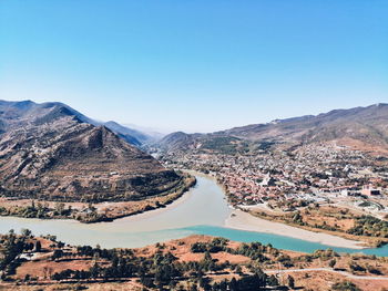 Scenic view of mountains against clear blue sky