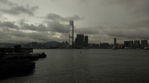 Cityscape against cloudy sky