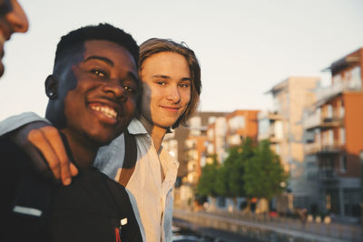 Portrait of smiling young man standing outdoors